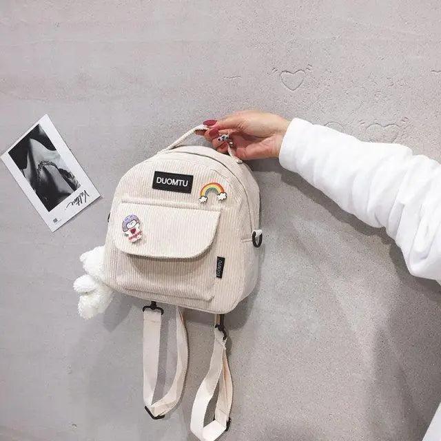 Mini beige Stevvex backpack with front pocket DUOMTU patch rainbow charm on Tampa Home & Garden Store