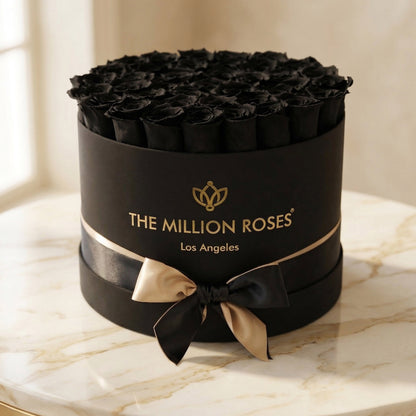 Supreme Black Box topped with black roses from The Million Roses in a matte black gift box on Tampa Home & Garden Store