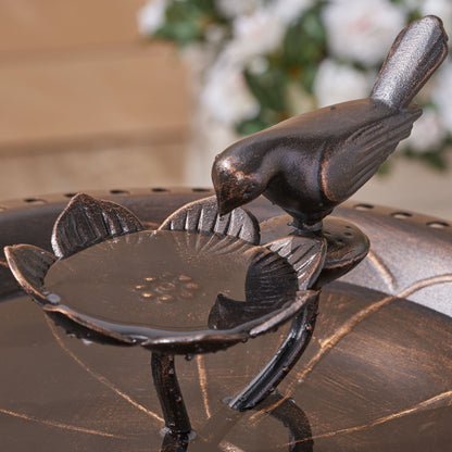 Outdoor bird bath with aluminum and iron construction and bronze finish, perched bird detail on Tampa Home & Garden Store