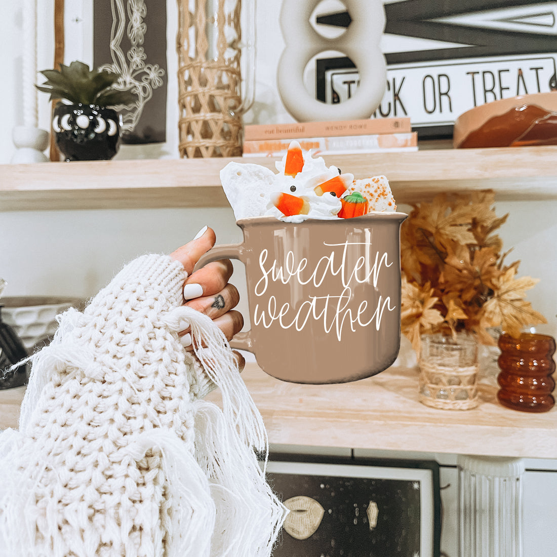 Taupe mug Sweater Weather with white script, filled with marshmallows on Tampa Home & Garden Store