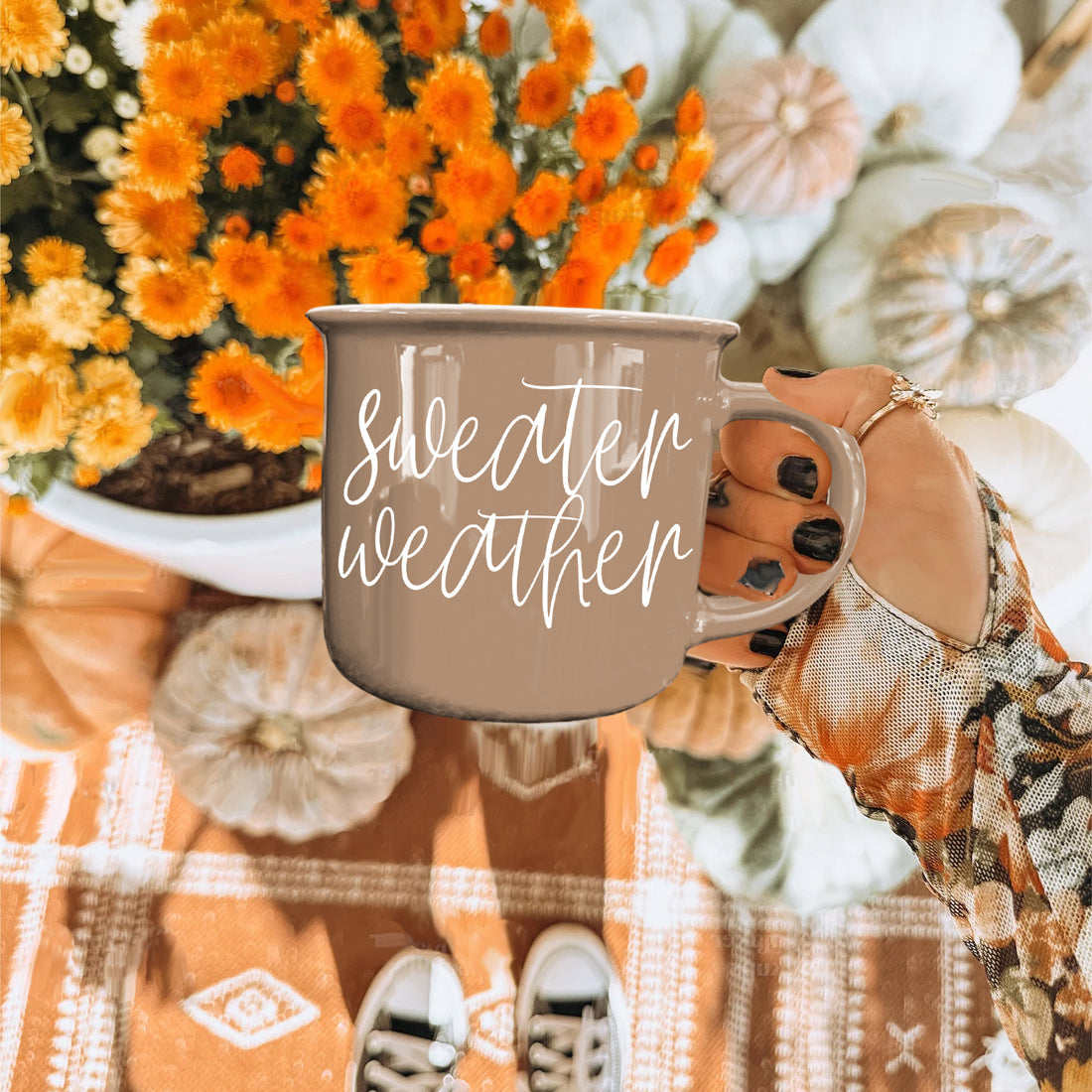 Gia Roma Sweater Weather coffee mug in taupe with white script, hand-held on Tampa Home & Garden Store