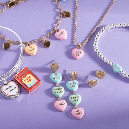 Sweethearts XOXO stud earrings with gold-tone hearts on pastel beads on purple backdrop on Tampa Home & Garden Store