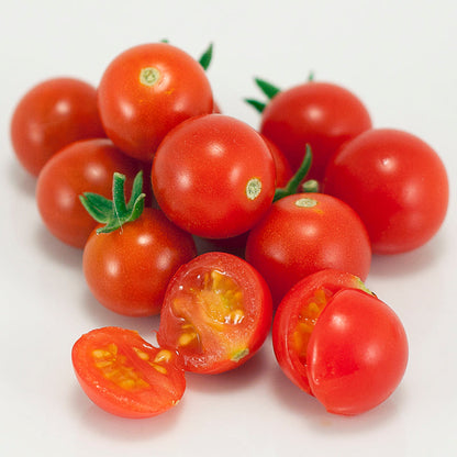 Sweetie Tomato Seeds red cherry tomatoes, whole and halved with seeds on white on Tampa Home & Garden Store