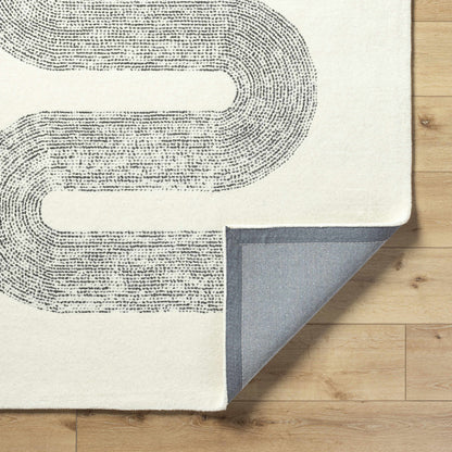 Saura Wool Area Rug Boutique Rugs in ivory with dark dotted pattern; several rug swatches on Tampa Home & Garden Store