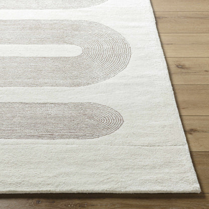 Saura Area Rug by Boutique Rugs, cream with taupe curved stripe pattern on Tampa Home & Garden Store