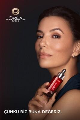 L'Oreal Paris Revitalift Triple Power anti-aging face serum bottle with dropper, red vial on dark backdrop on Tampa Home & Garden Store