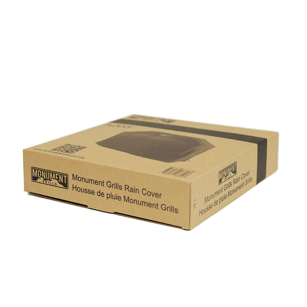 Monument Grills Rain Cover packaging box, brown cardboard with product image on Tampa Home & Garden Store