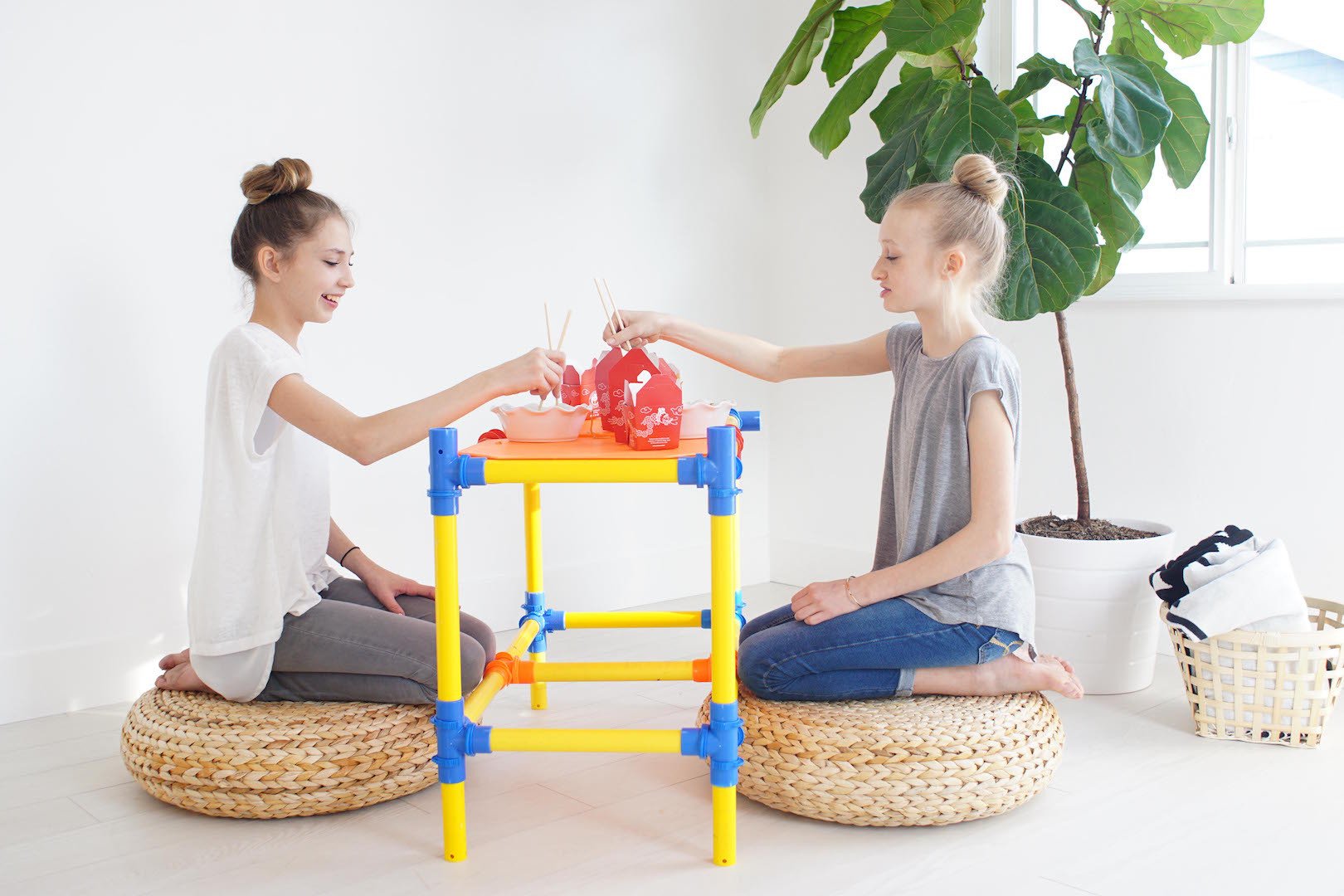 TubeLox Deluxe Set STEM toy, bright yellow and blue construction tubes with kids playing on Tampa Home & Garden Store