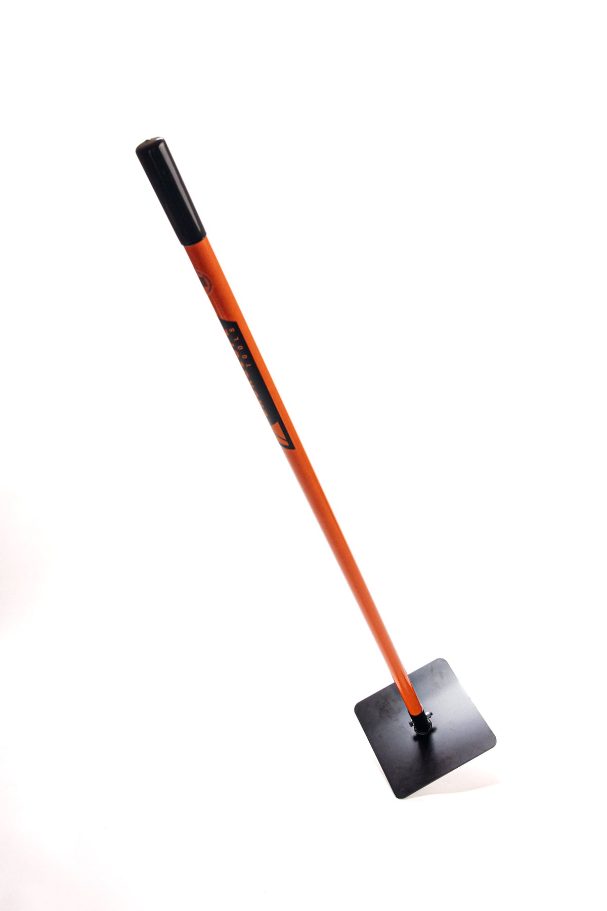 Roger Tamper from Backslope Tools with orange shaft, black cap, and square metal tamping head on Tampa Home & Garden Store