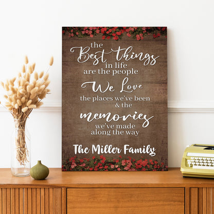Best Things In Life Sign II canvas by Tailored Canvases with wood backdrop and red floral border on Tampa Home & Garden Store