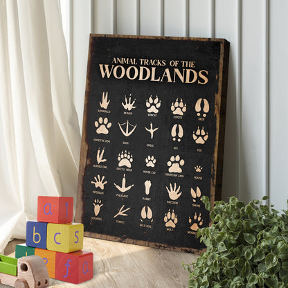 Animal Tracks Of The Woodlands Sign II canvas featuring beige animal track icons on a black surface on Tampa Home & Garden Store