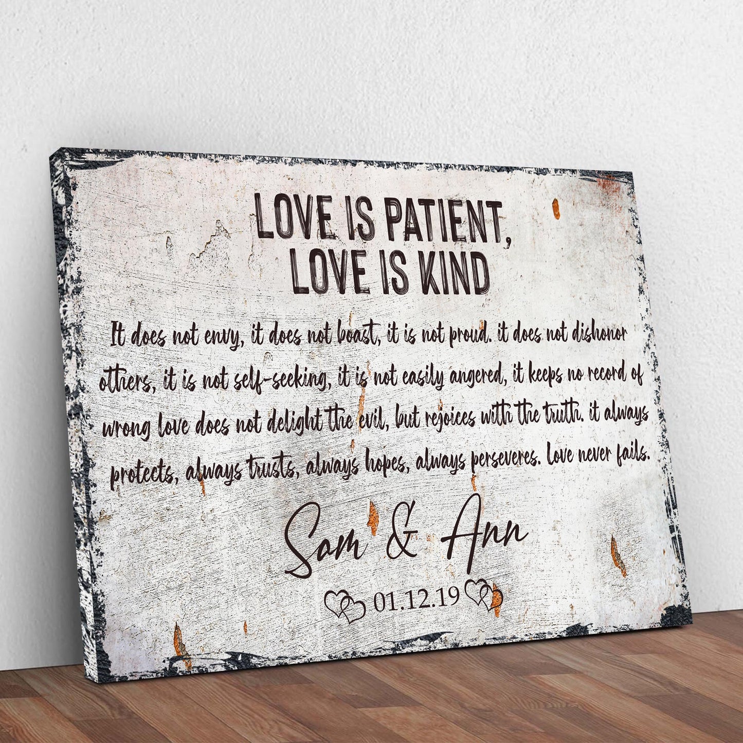 Love Is Patient, Love Is Kind canvas sign by Tailored Canvases with a distressed white backdrop and black typography on Tampa Home & Garden Store