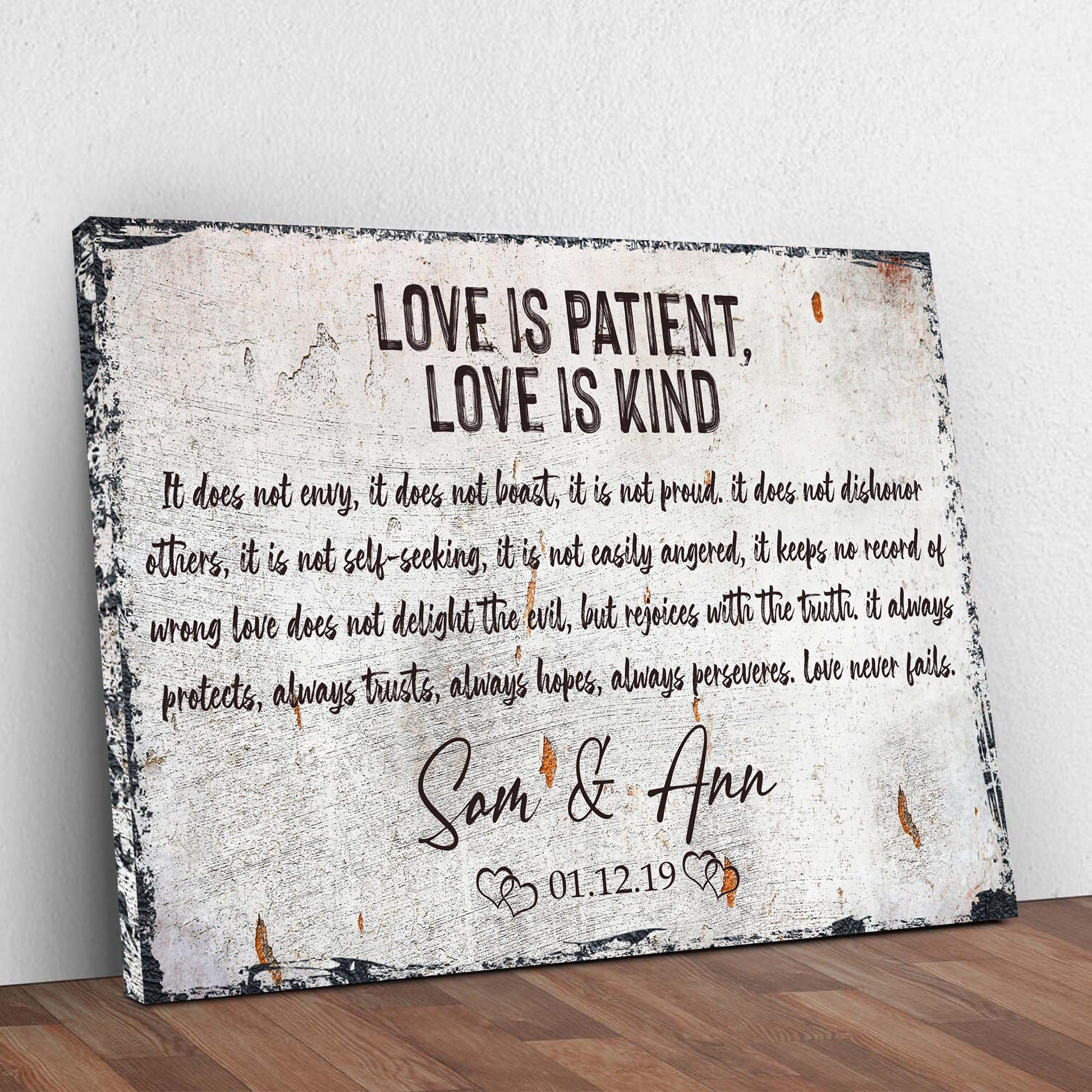 Love Is Patient, Love Is Kind canvas sign by Tailored Canvases with a distressed white backdrop and black typography on Tampa Home & Garden Store