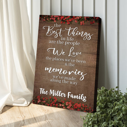 Best Things In Life Sign II canvas with rustic wood backdrop and red floral border on Tampa Home & Garden Store