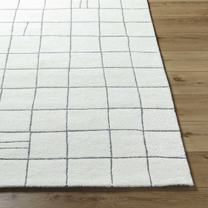 Tanya Pearl White Grid Wool Rug with gray grid lines on wood floor on Tampa Home & Garden Store