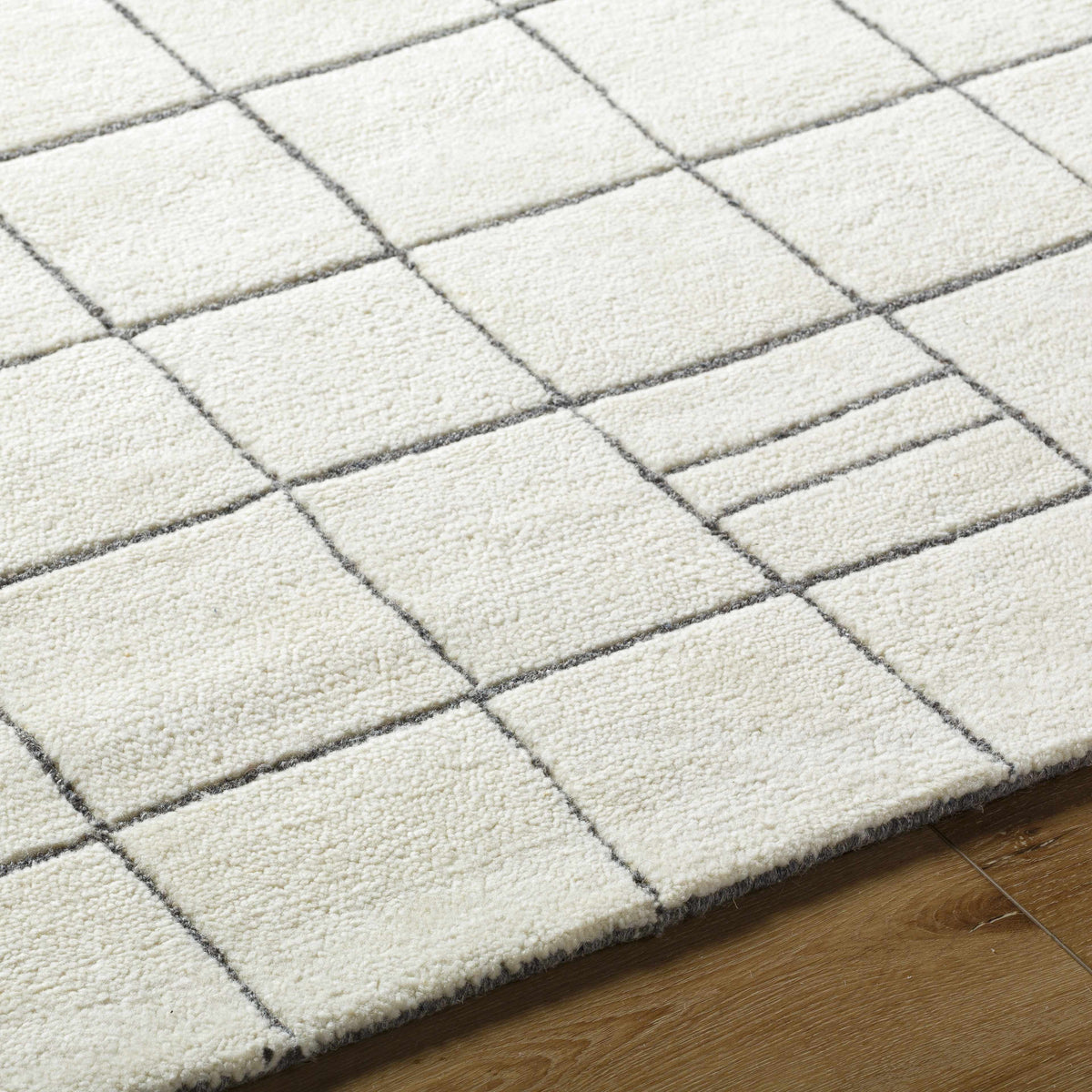 Tanya Pearl White Grid Wool Rug by Boutique Rugs, cream with charcoal grid lines on white field on Tampa Home & Garden Store