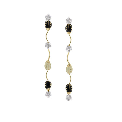 Lady Poof Dangle Earrings pair goldtone curved stems, black oval beads, beige beads on Tampa Home & Garden Store