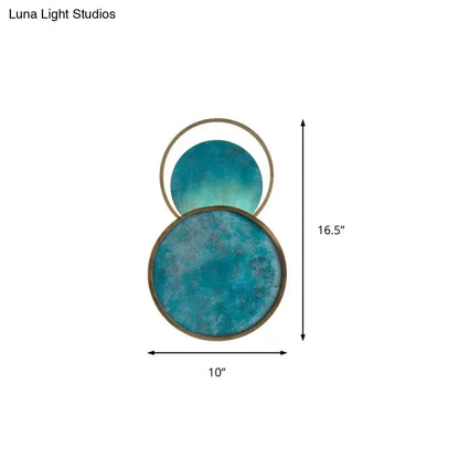 Teal glass LED wall sconce with two discs and brass trim, warm white glow by Decorbites on Tampa Home & Garden Store