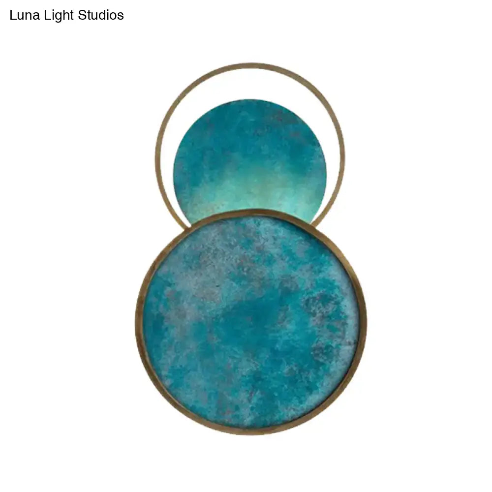 Teal Glass LED Wall Sconce brass ring with overlapping discs Decorbites warm white light on Tampa Home & Garden Store