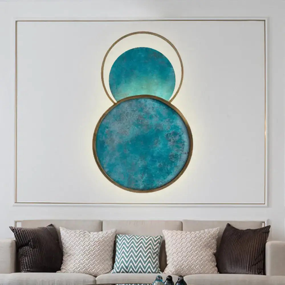 Teal Glass LED Wall Sconce by Decorbites, 2 overlapping teal discs in brass frames, warm white light on Tampa Home & Garden Store