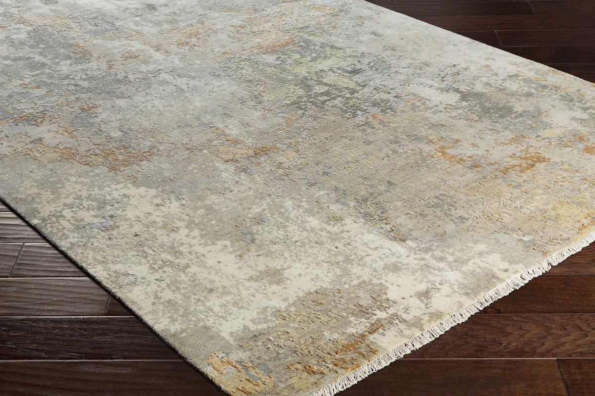 Telogia Carpet - Clearance rug by Boutique Rugs in abstract gray-beige with fringe on hardwood floor on Tampa Home & Garden Store