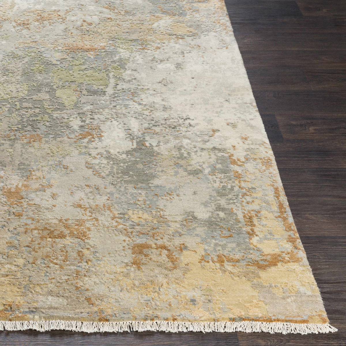 Telogia Carpet rug by Boutique Rugs in light neutral tones with fringe on dark wood floor on Tampa Home & Garden Store