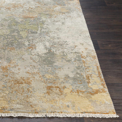 Telogia Carpet rug by Boutique Rugs in light neutral tones with fringe on dark wood floor on Tampa Home & Garden Store