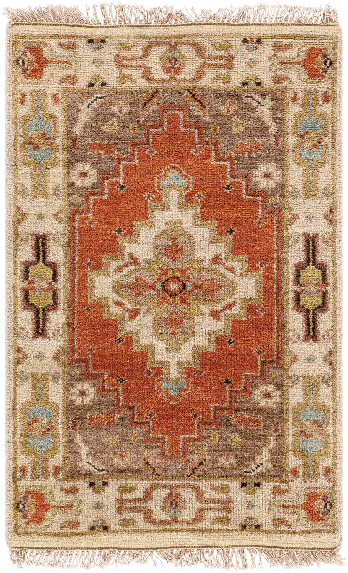 Texico Area Rug by Boutique Rugs, warm orange central medallion on ivory field with fringe on Tampa Home & Garden Store