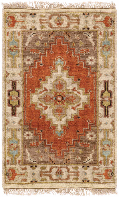 Texico Area Rug by Boutique Rugs, warm orange central medallion on ivory field with fringe on Tampa Home & Garden Store