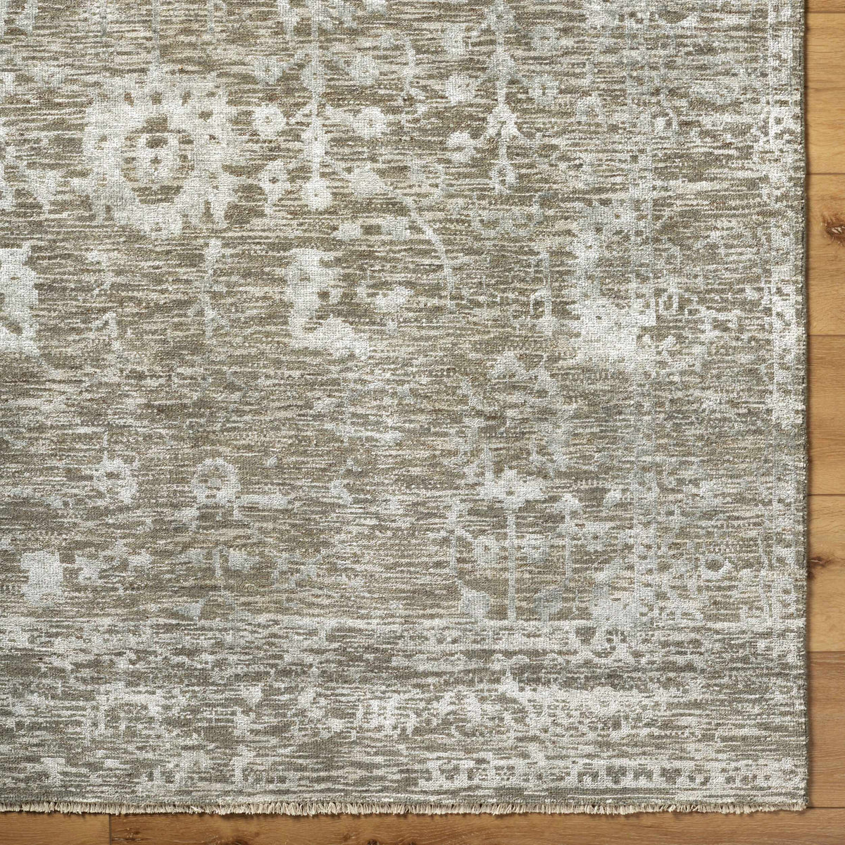 Beige Akos Area Rug by Boutique Rugs, distressed pattern with fringed edge on wood floor on Tampa Home & Garden Store
