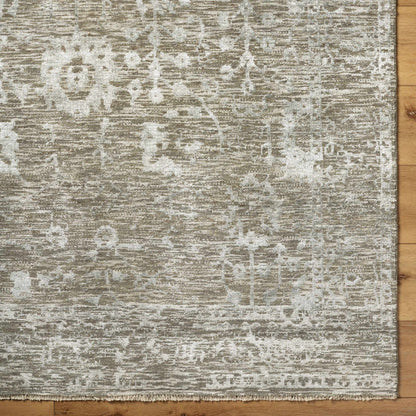 Beige Akos Area Rug by Boutique Rugs, distressed pattern with fringed edge on wood floor on Tampa Home & Garden Store
