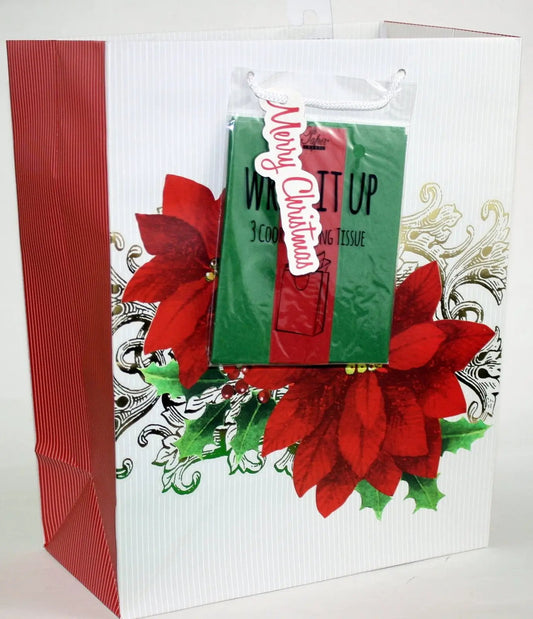 Gift bag with tissue featuring large red poinsettias on white striped bag with red side panel on Tampa Home & Garden Store