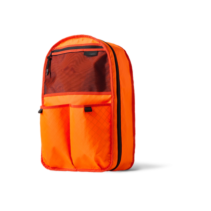 Conceal Pack 21L orange backpack by The Brown Buffalo with front mesh pocket on Tampa Home & Garden Store