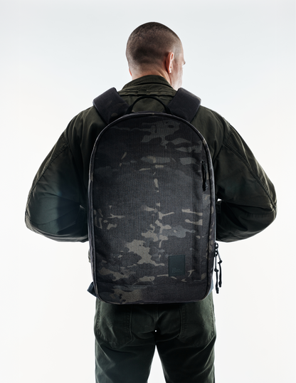 The Brown Buffalo Conceal Pack 21L camouflage backpack worn by a person from the back on Tampa Home & Garden Store