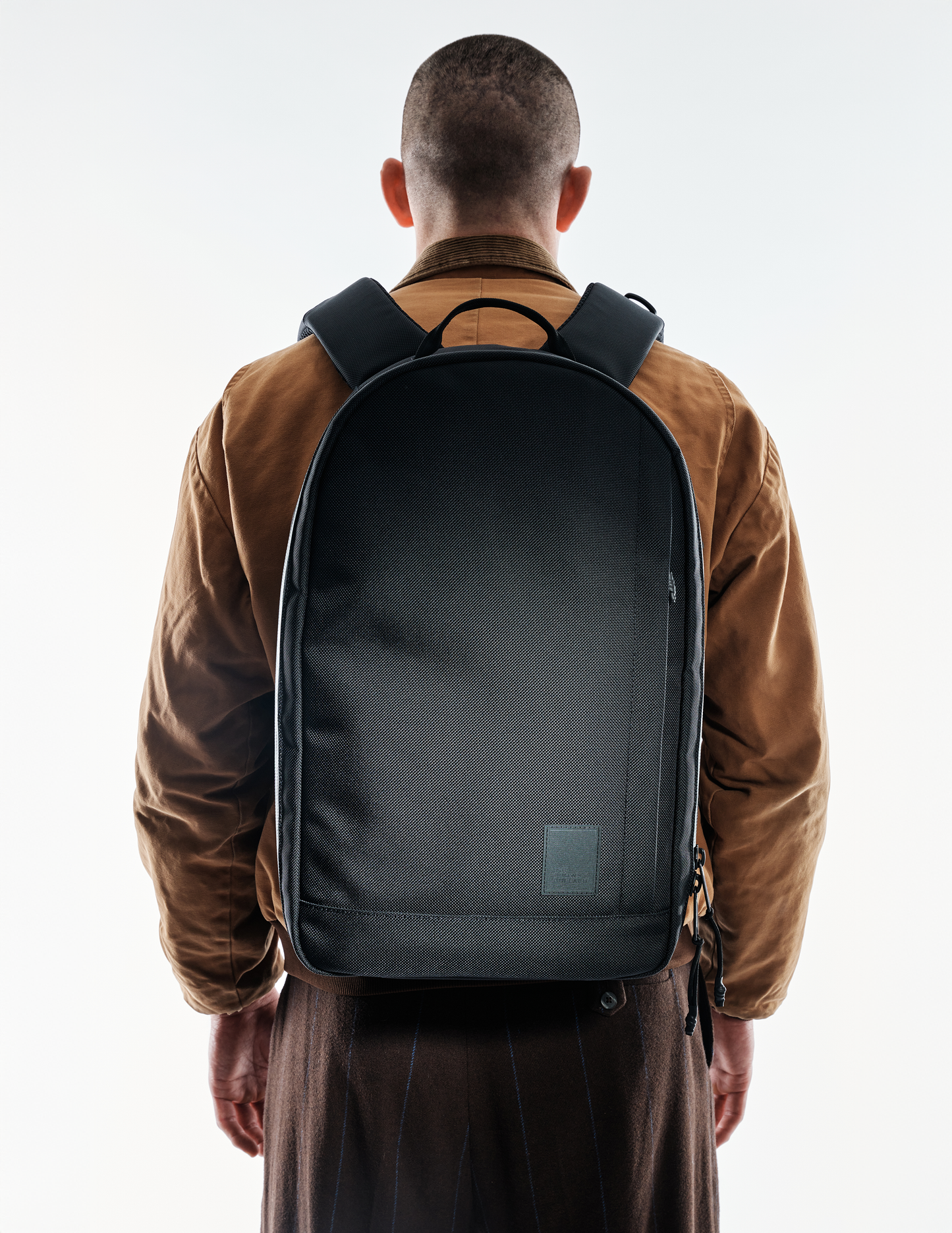 Conceal Pack 21L backpack by The Brown Buffalo, black textured fabric with padded straps on Tampa Home & Garden Store