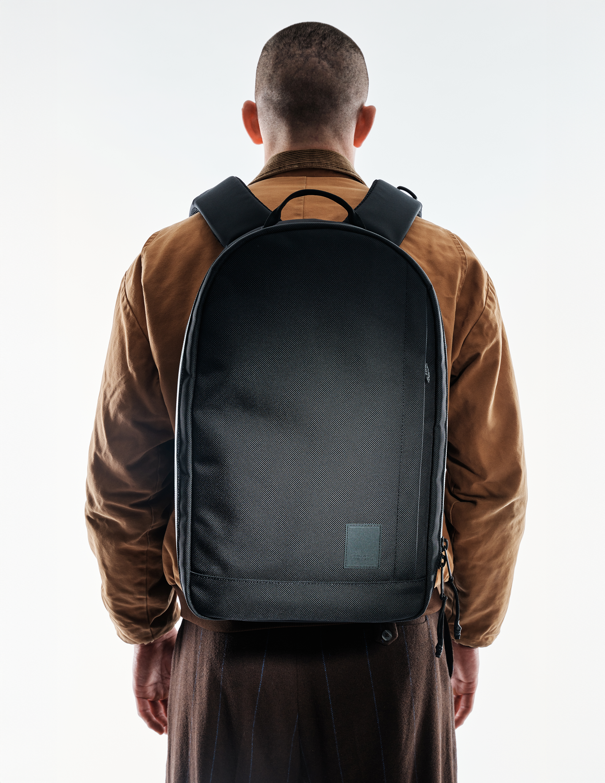 Conceal Pack 21L backpack by The Brown Buffalo, black textured fabric with padded straps on Tampa Home & Garden Store