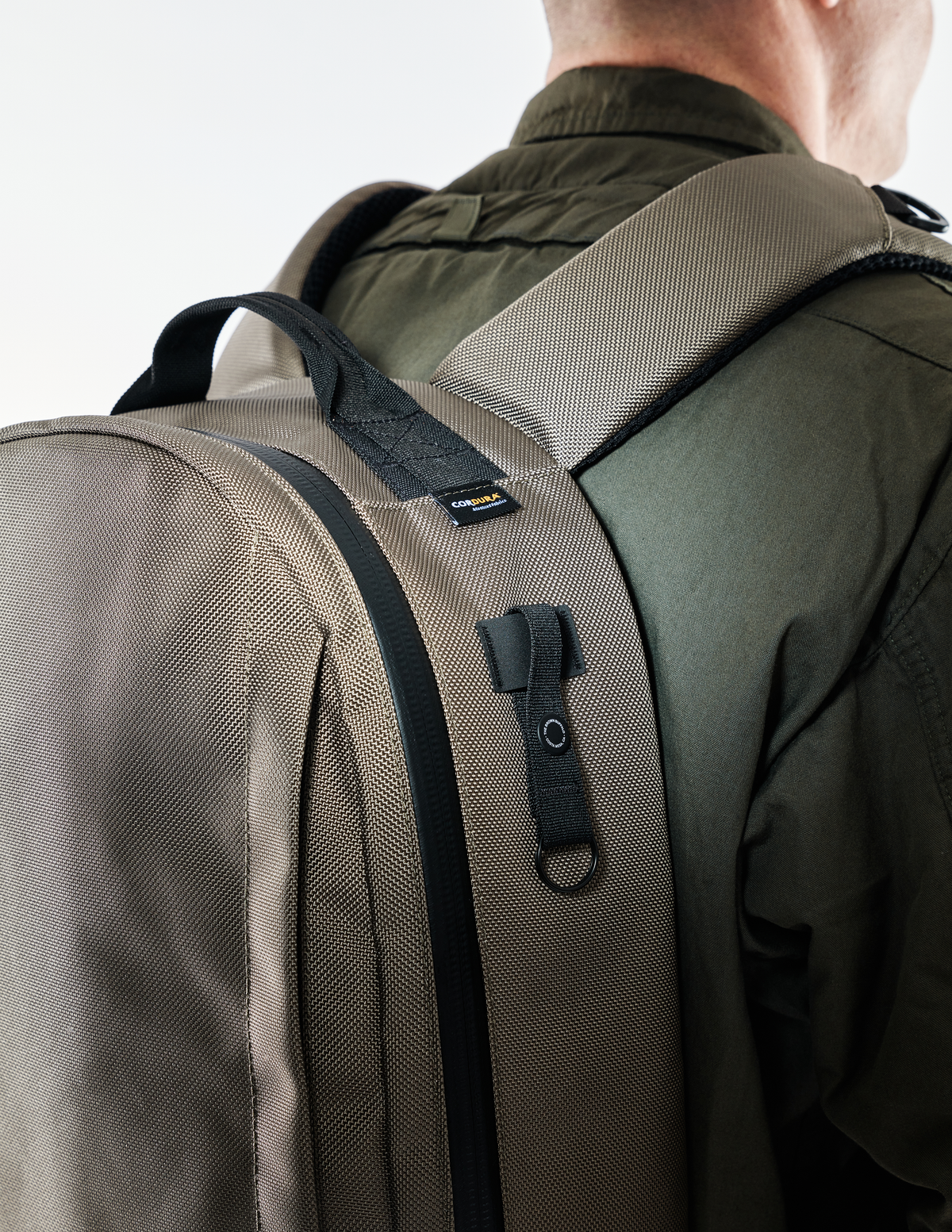 Conceal Pack 21L backpack in tan Cordura fabric with padded shoulder straps on Tampa Home & Garden Store