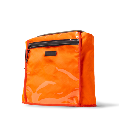 Conceal Tote bag by The Brown Buffalo in bright orange with black zipper pockets and gray trim on Tampa Home & Garden Store