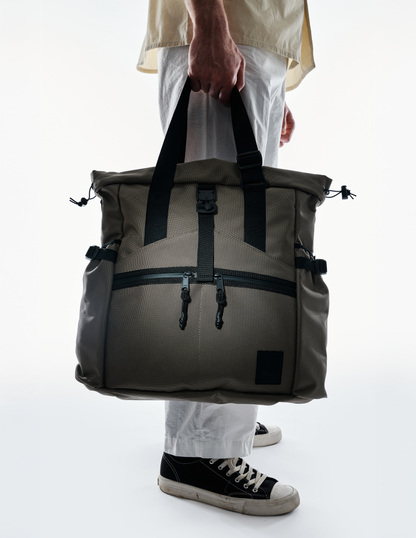 Conceal Tote by The Brown Buffalo, khaki canvas tote with black straps and front zipper pockets on Tampa Home & Garden Store