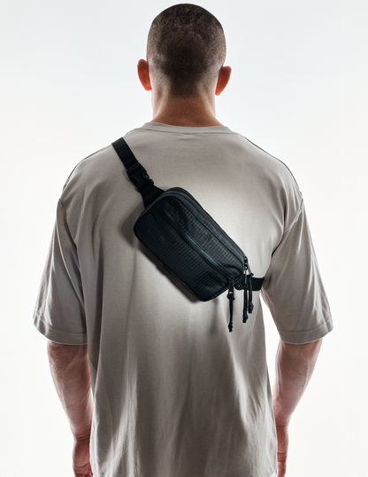 Conceal Waistpack The Brown Buffalo black nylon fanny pack worn crossbody with dual zippers on Tampa Home & Garden Store