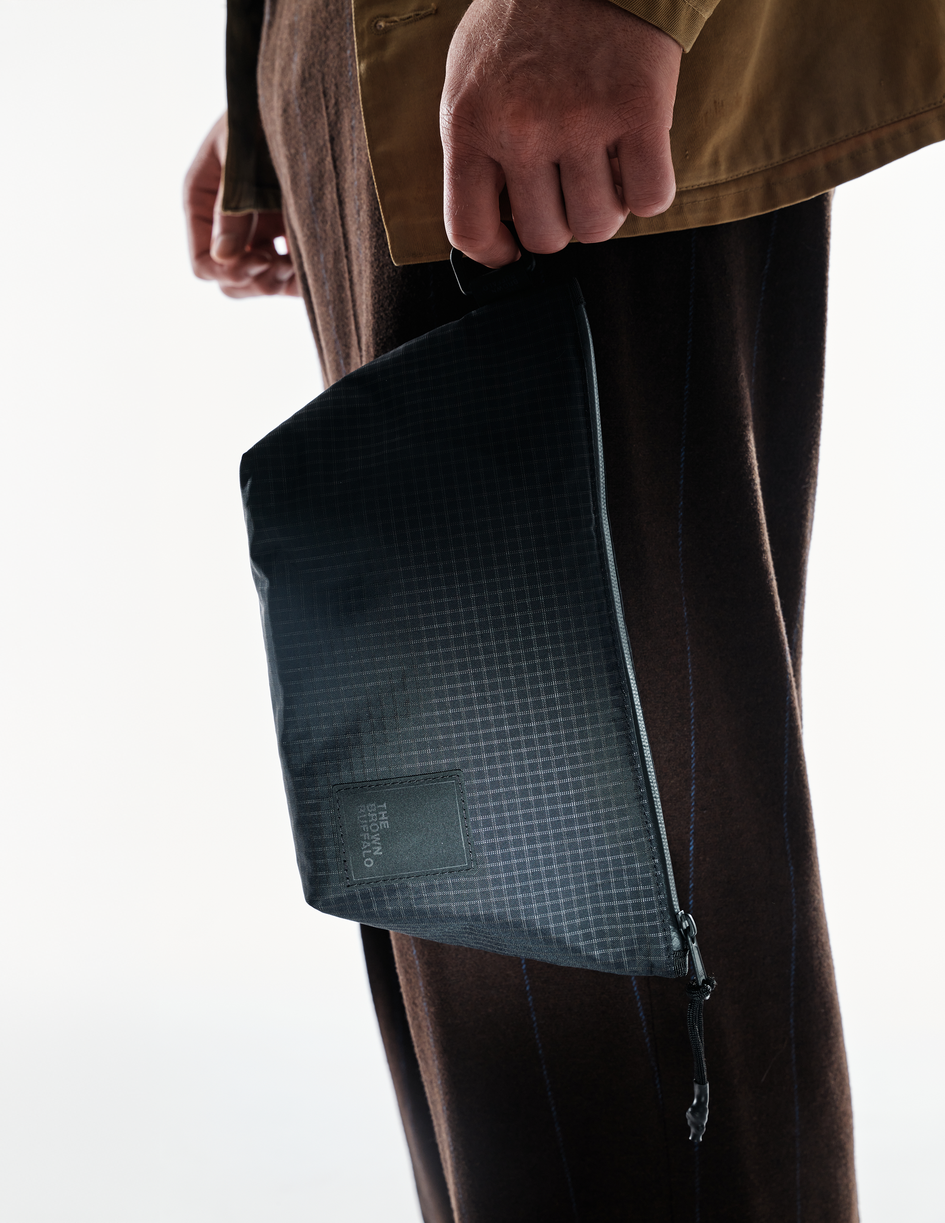 Dopp Kit by The Brown Buffalo; dark grid-pattern toiletry bag with zipper on Tampa Home & Garden Store