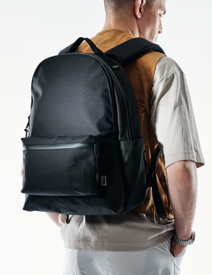 Backpack The Brown Buffalo Standard Issue in black textured fabric with front zip pocket on Tampa Home & Garden Store