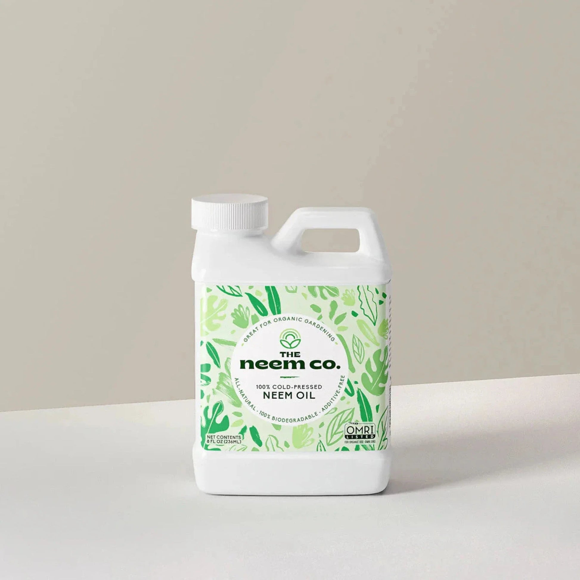 Organic Neem Oil bottle with green botanical label and The Neem Co. branding on Tampa Home & Garden Store