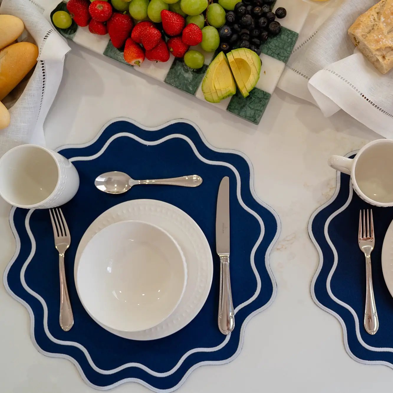 Solid Navy Wave Placemat by Talah Home with navy wave edge and white trim for two on Tampa Home & Garden Store