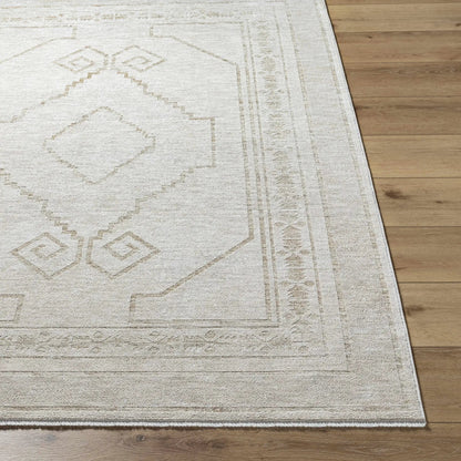 Taban Luxe Rug in ivory beige with geometric diamond motif and bordered fringe on Tampa Home & Garden Store