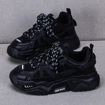 Stevvex black chunky sneakers pair shown with mesh panels, speckled laces, thick platform sole on Tampa Home & Garden Store