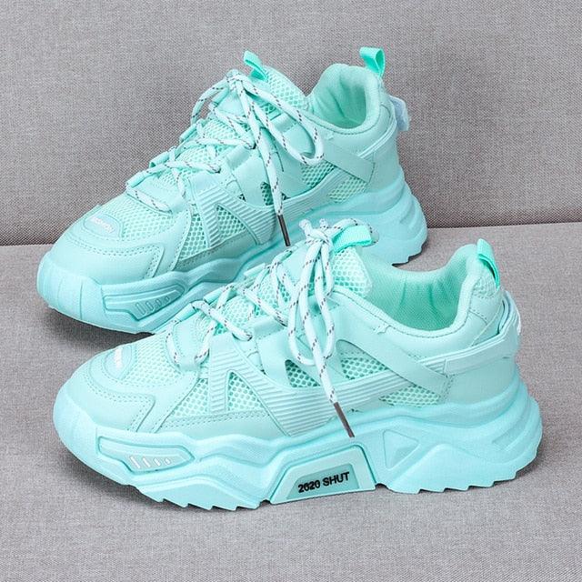 Chunky platform sneakers in mint turquoise with mesh panels and white laces, pair on Tampa Home & Garden Store