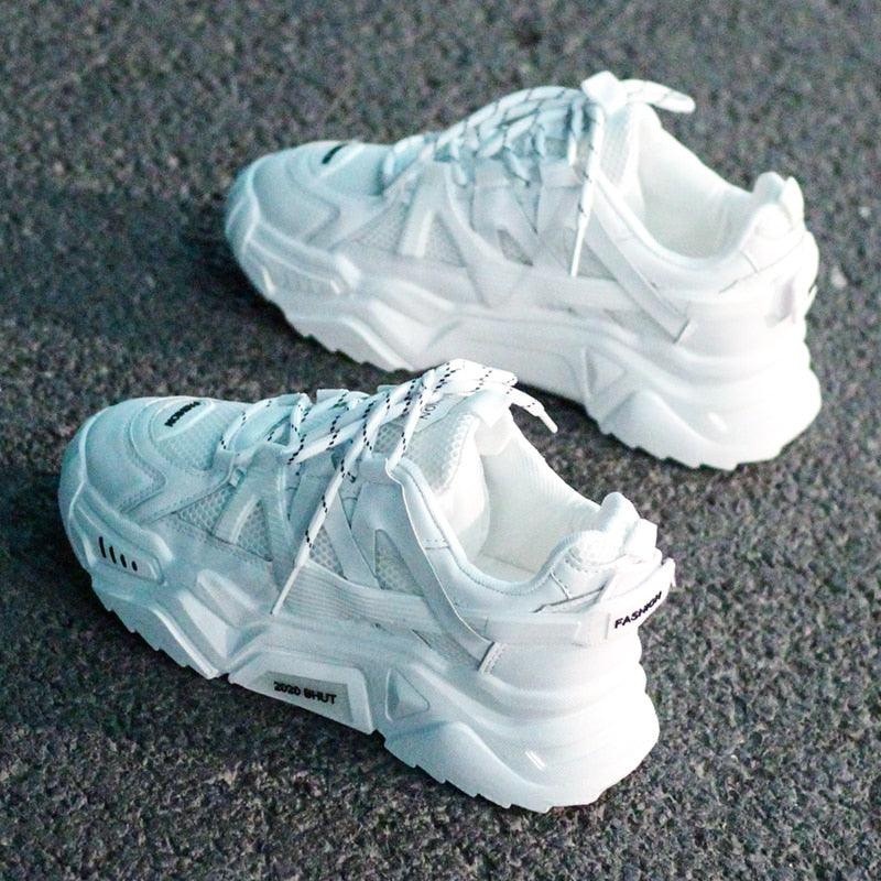 Thick white platform sneakers with blue mesh accents, lace-up low-top trainers on Tampa Home & Garden Store