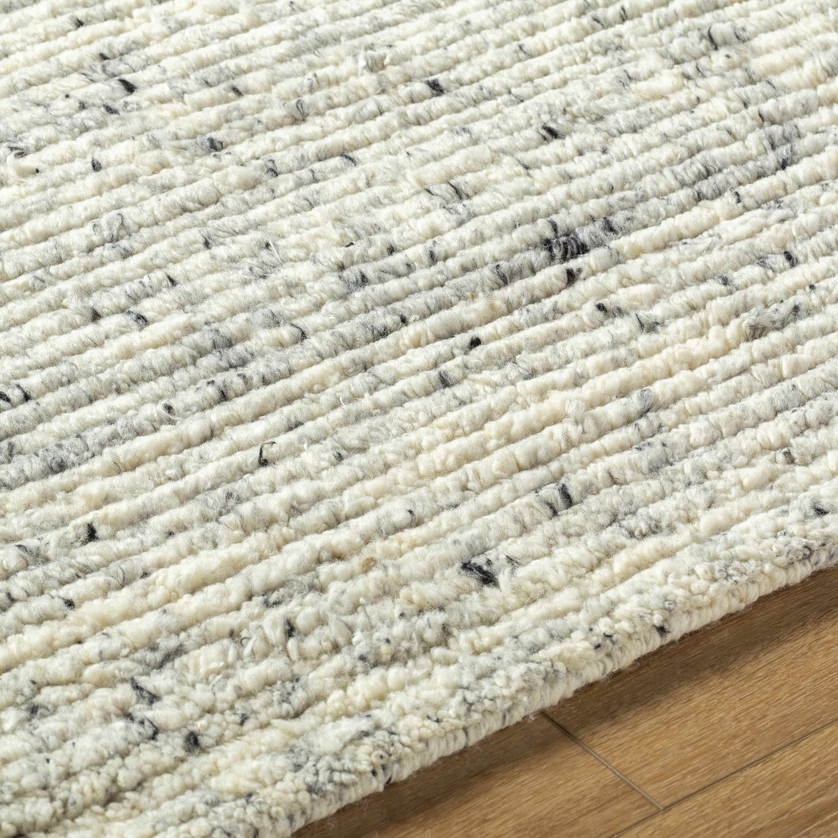 Torie Green NZ Wool Area Rug by Boutique Rugs in cream with black flecks, looped wool texture on Tampa Home & Garden Store