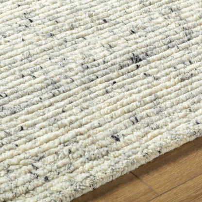 Torie Green NZ Wool Area Rug by Boutique Rugs in cream with black flecks, looped wool texture on Tampa Home & Garden Store
